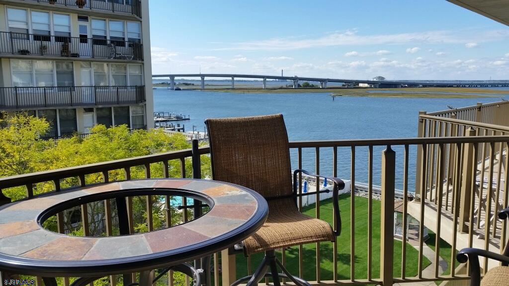 Balcony seating overlooking the bay and bridge at 500 Bay