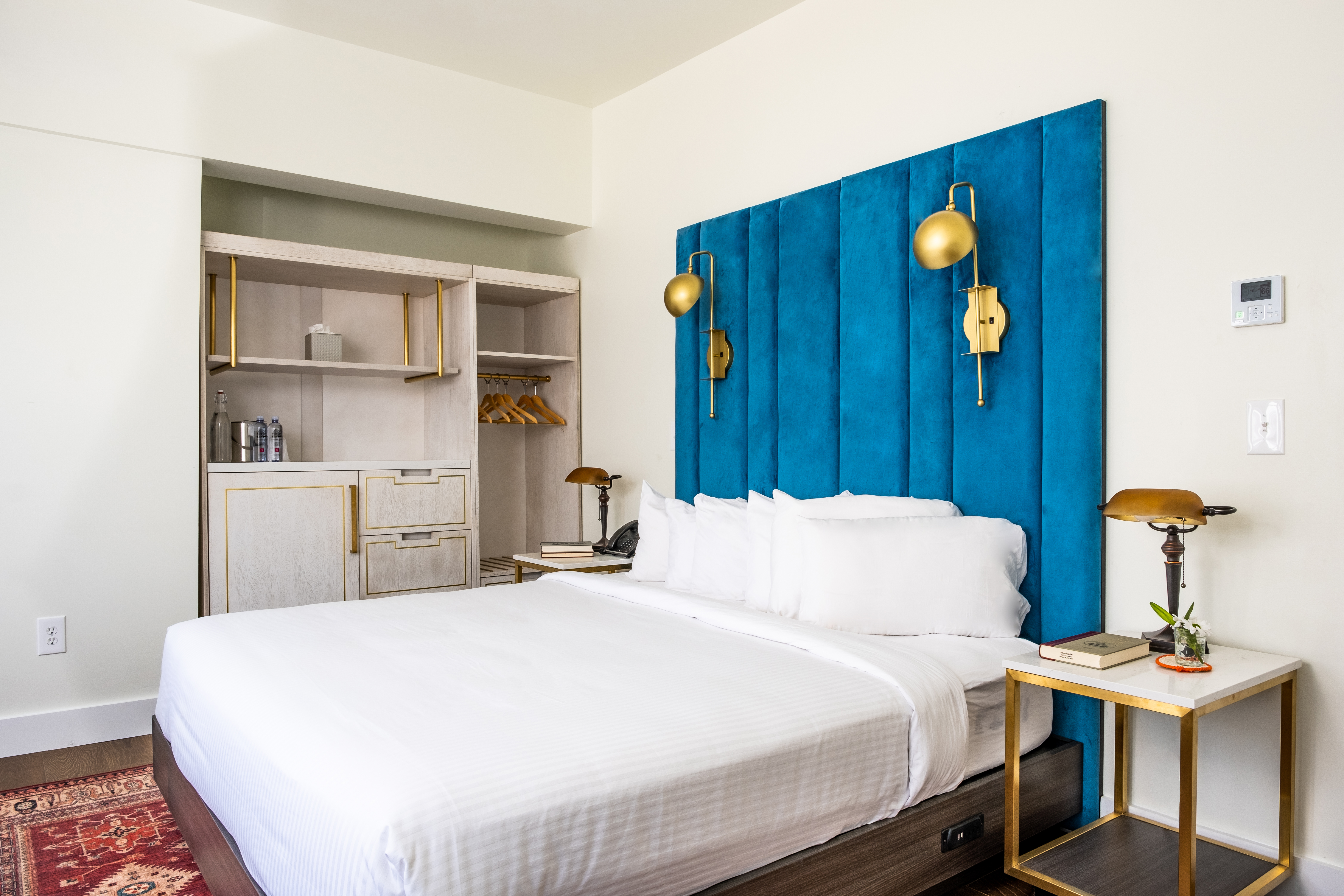 Scarborough Inn guest room with blue headboard